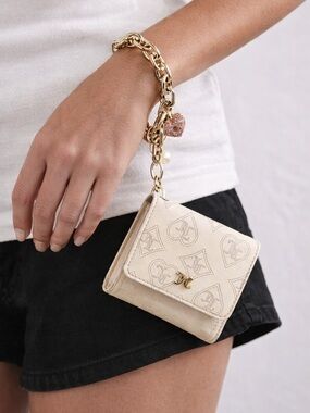 Juicy Couture Wristlet Wallet On A Gold Link Bracelet with Charm
